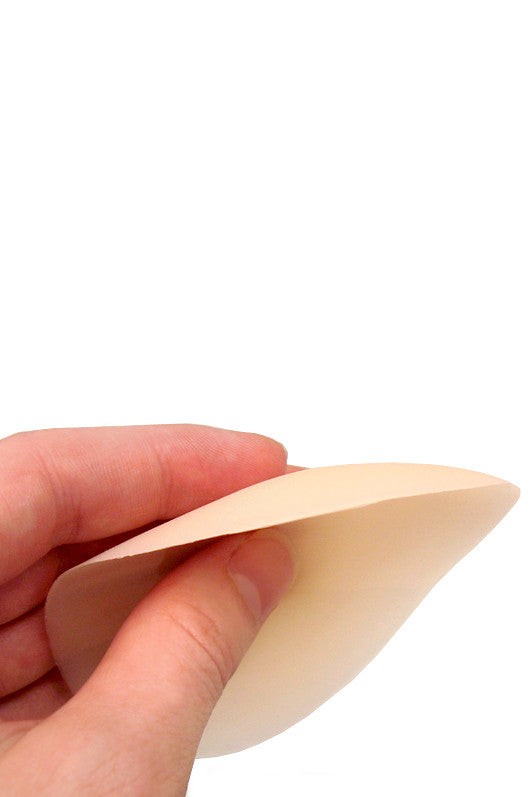 Boobles - Non-adhesive Silicone Pasties being held in a hand to showcase their design and flexibility.