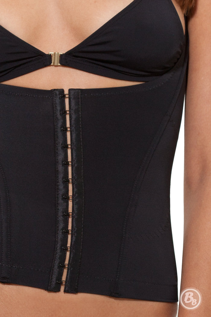 Close-up of the Waist Cinching Vest showcasing adjustable straps and front hook-and-eye closure for a slimmer silhouette.